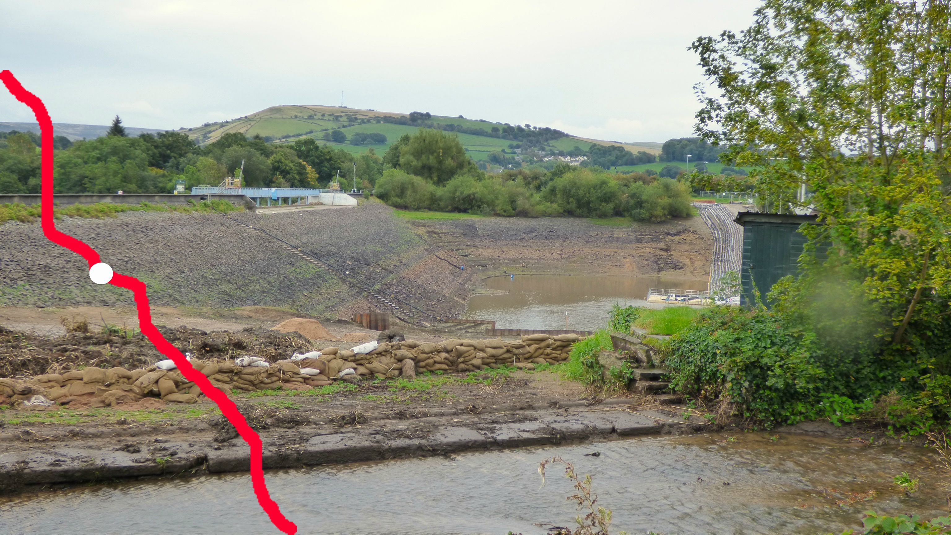 The reservoir is now drained whilst the dam is repaired.